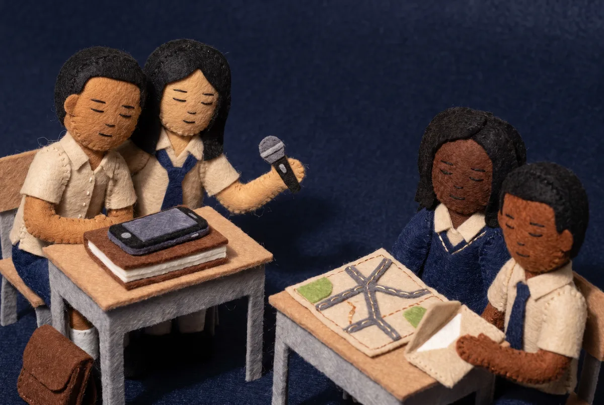 The scene in Felt style: three participants planning a video about their neighbourhood